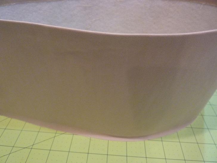 Assemble top and bottom 1. Both exterior sections should still be right side out. 2. Using a pressing cloth, lightly press the bottom raw edge of the top section to set a ½" crease line all around. 3.