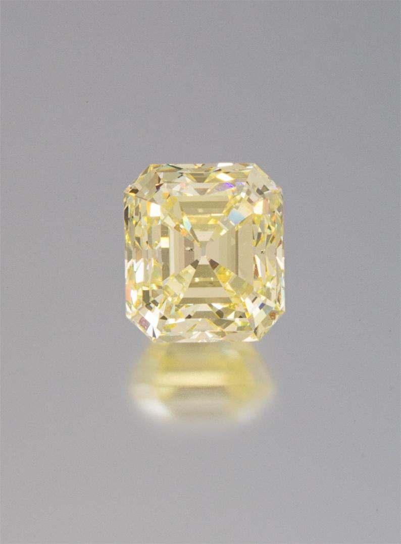 Sale 394 Lot 269 A 10.48 Carat Octagonal Step Cut Fancy Yellow Diamond, measuring approximately 12.69 x 11.35 x 8.63 mm, together with a yellow gold ring setting.
