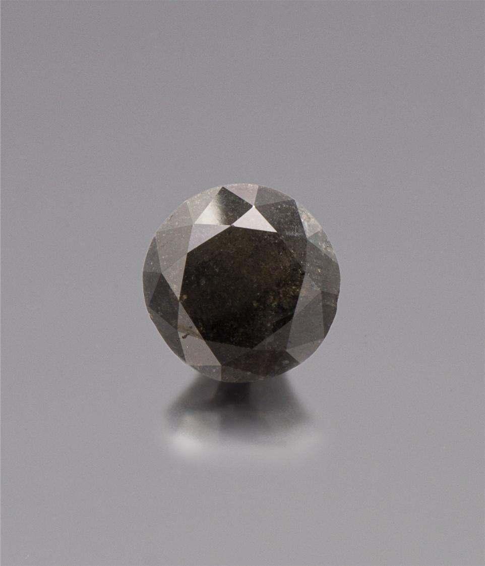 Sale 394 Lot 267A A 24.29 Carat Round Brilliant Cut Natural Black Diamond, measuring approximately 17.56 x 17.08 x 13.25 mm.