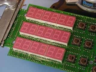 Install the seven segment displays on the same side of the PCB as the tact switches. That is, the display side of the PCB.