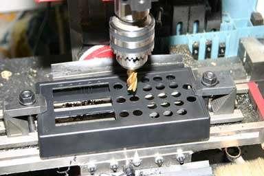 469 (12mm) diameter called out for the tact switch buttons can be drilled with a 1/2" diameter drill bit.