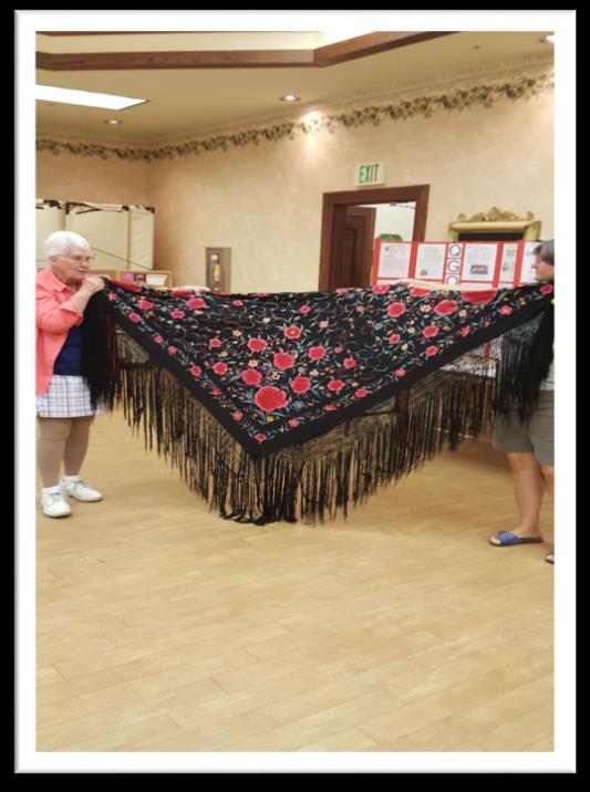 Jan bought in this beautiful piano shawl. This was something that she purchased and she wanted to know if anyone knew what kind of material it was made of.