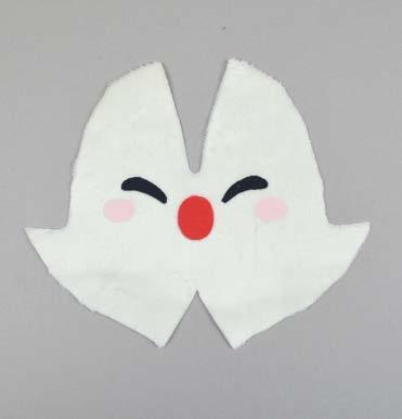 Set your paper pattern on top of the fabric piece (right sides up), align the nose piece on top where the