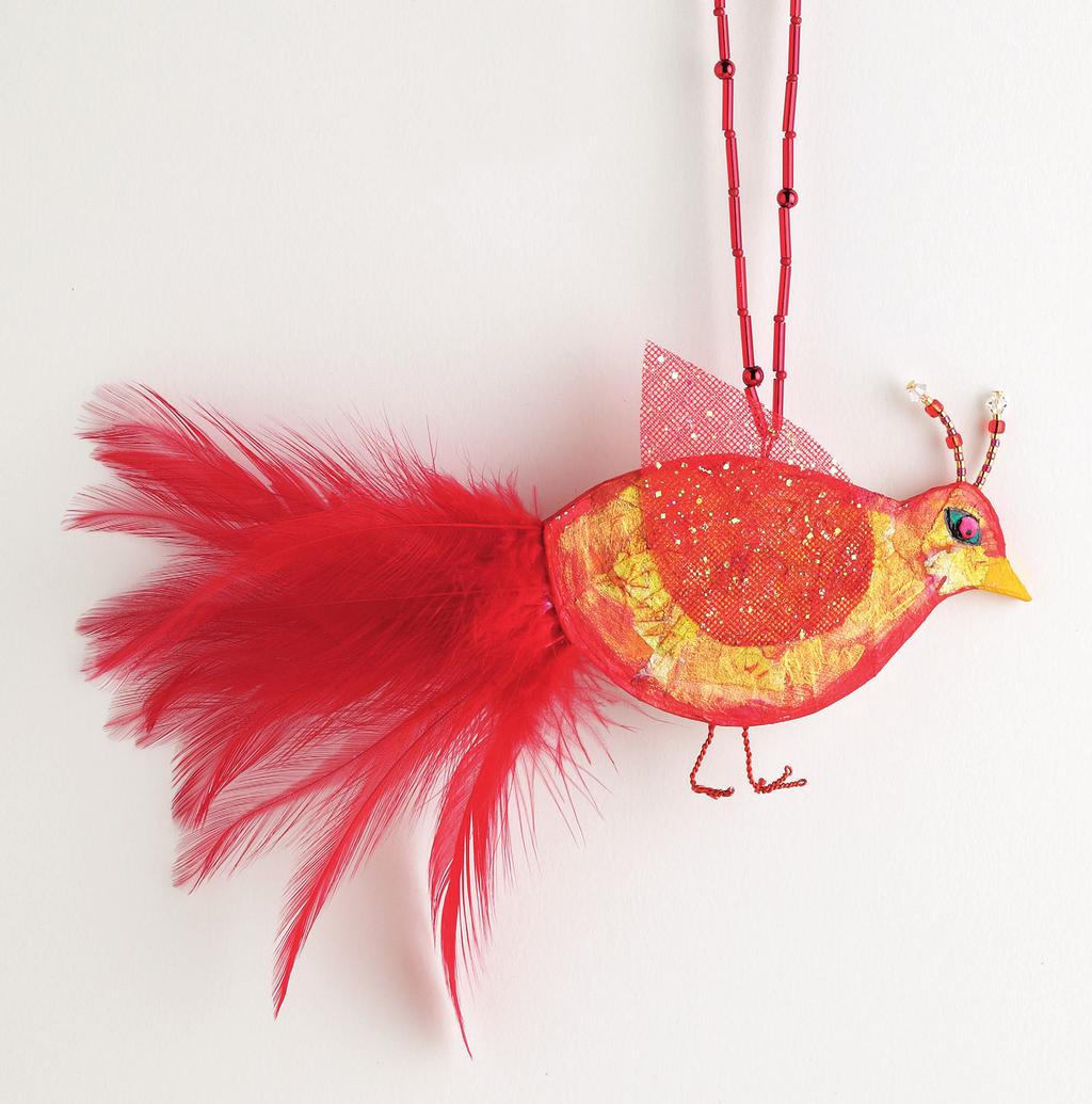 My red bird ornament sports beaded headgear and a beaded hanger.