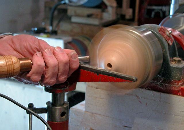 Mount the piece between centers to begin with, and turn a round tenon suitable for mounting in a chuck.