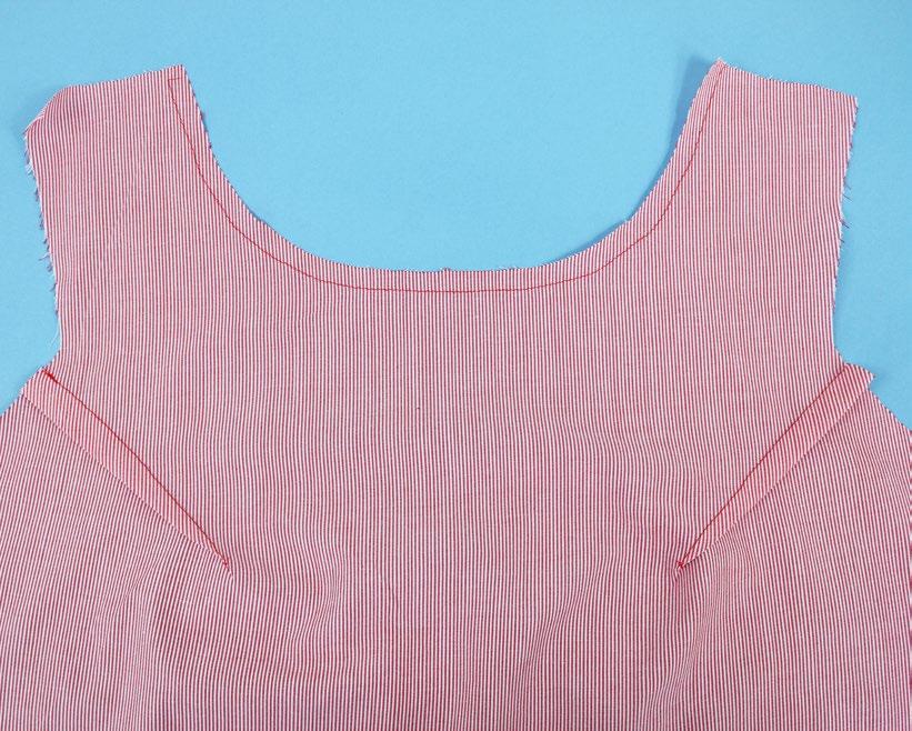 3 4 Stitch the front bodice darts and press them down towards the hem.