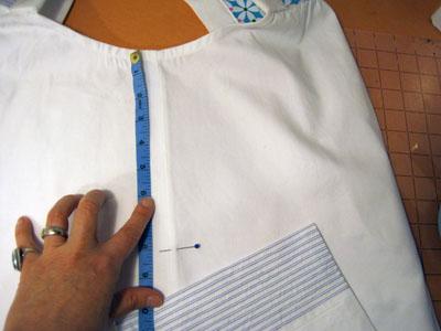 With right side out, place smock down, centering one of the side seams.