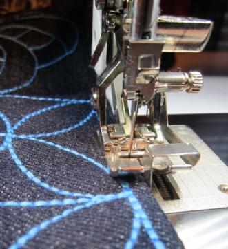 Trim the embroidery to 6 squares. Set the machine for stitching. Switch to 40 wt. polyester thread in top and bottom.