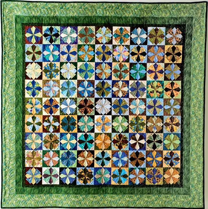 SCRAPPY PINWHEELS 86" x 86". Made by Joyce Stewart; quilted by Ann Seely. One year we vacationed in Hawaii with Mom and Dad and went to a Muu Muu factory.