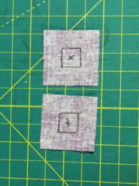 Cut two 1 ½ squares from scrap fabric and
