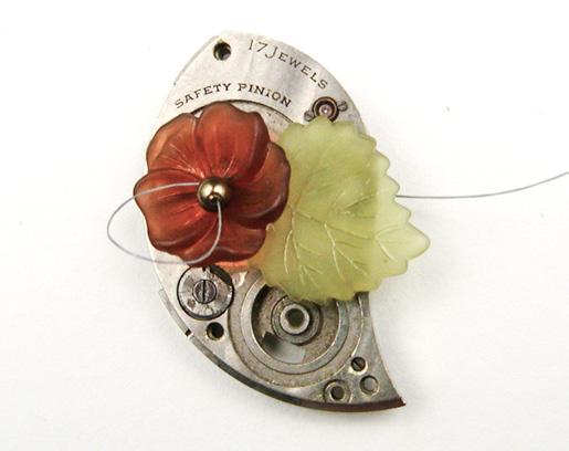 [4] Pick up a 16 x 17 mm Lucite leaf, and sew through an adjacent opening in the watch plate and the Ultrasuede (photo m). Sewing through adjacent holes helps to stabilize the leaf.