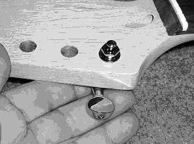 TUNERS Install the tuners from the back of the headstock. If the pilot holes for the screws are not already drilled, drill them now. Be sure not to drill all the way through the headstock!