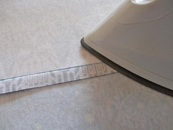 4. Press the seam allowance towards the bottom panel. 5. Find the tapestry needle and pearl cotton floss. 6.