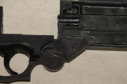 amount from the top and front edge of the frame stop (the angled hook like object in front of the hinge on the grip frame).