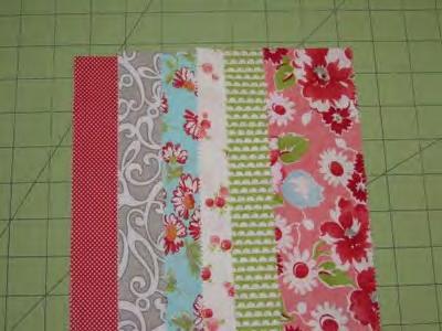 Choose 6 jelly roll strips to set aside. This will be the outer 6 sides of the hexagon.