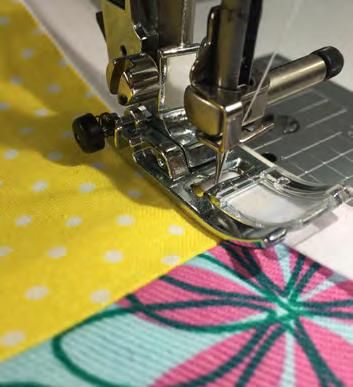 Make sure the longer side of the tape will be sewn onto the bottom of the fabric.