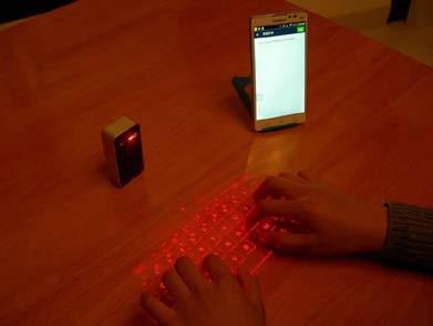 In a laser virtual holographic keyboard, it usually uses a red laser as the light source, and generates a virtual keyboard image on a plane by the DOE.