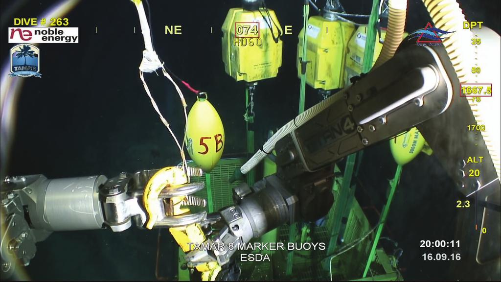 Figure 3: The ROV s manipulator disconnecting the vessel crane from the work basket in preparation for removal and placement of the Compatts and markers in a water depth of 1,667.5 m.