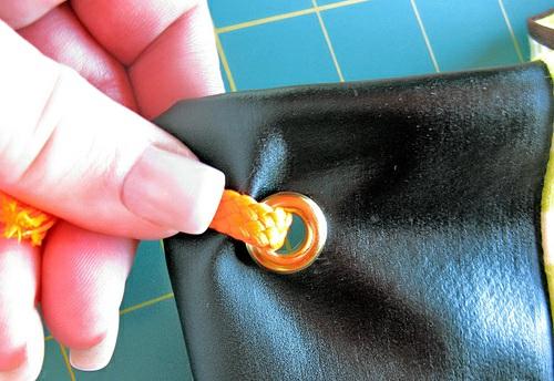 But the second one is a little trickier. The ends are going to be frayed and it's a tight fit through the eyelet. Try wetting the end and twisting it to compact the frayed edge.