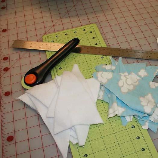 Use the template, your straight edge and scissors or cutting wheel to cut 20 pieces of fabric.