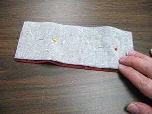 To prepare the strap for the snap closure, cut two pieces of fabric to 3 inches by 8 inches.
