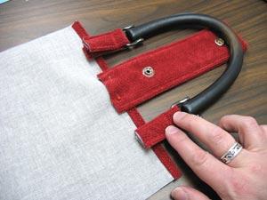 Sew the loops in place by sewing a seams right along the top edge of the outer shell fabric.