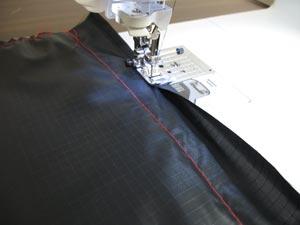 Next, fold the short ends of the lining fabric over to the wrong side 1/2 inch and sew a