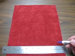 With an air-erase pen, measure and mark down 4 1/2 inches on each side, starting at the top edges. Then, measure and mark in 4 3/4 inches from one of the corners along the top edge.
