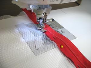 Using a zipper foot, sew a seam right along the inner edge of the bias tape.