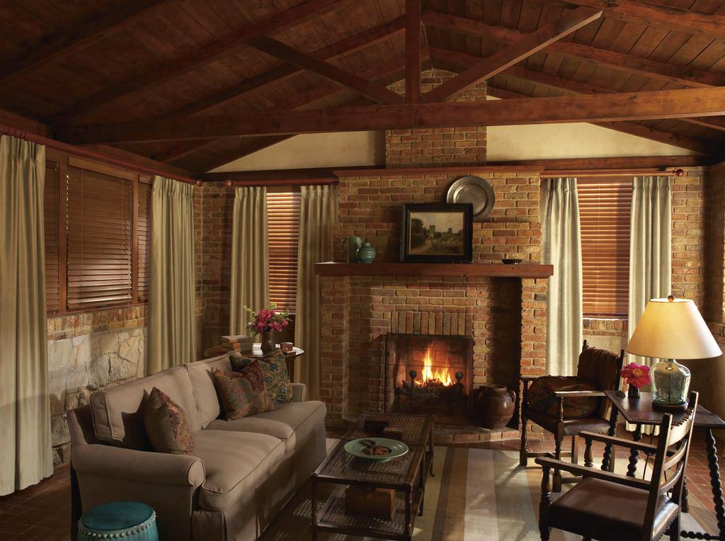 Featured here: Kirsch Estate Wood Trends decorative traverse rod and Wood Trends