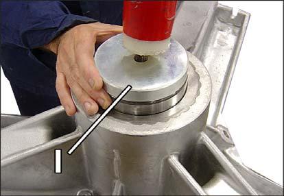 hole in the outer drum. - Remove the Vring seal and remove the ring seals from the drum shaft using tool J.