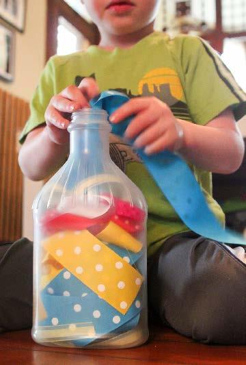 Add a spark of fun to it with a simple spoon, or craft stick to push the ribbons down through the neck of the bottle.