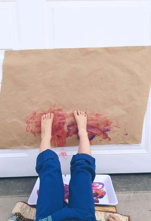 Laying Down Feet Painting butcher (art) paper paint tray wall (garage door or fence) Tape a large piece of paper on a wall