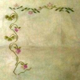 Needleworks mounted on a small hornbook from Valley House