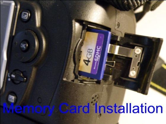 6 Install memory card (card may already be in the camera) by opening the door located on the right side of the camera and gentally pushing the card in until it clicks in place.