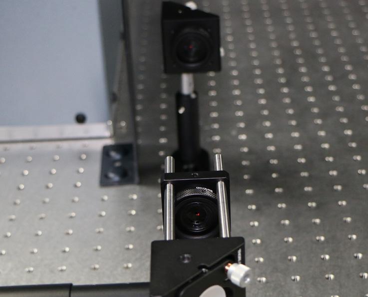 Using the white levers on the second steering mirror, pictured above, the laser beam has been aligned to the centre of the second iris. 3.