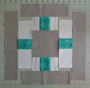 Each block uses one (1) charm square, two (2) Unit As, two (2) Unit Bs, two (2) 9 inch long jelly roll strips,