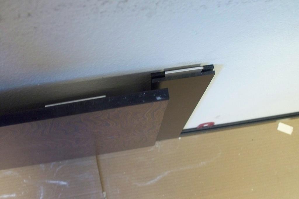 Find the vertical joint trim and cut it to fit between the horizontal trim.