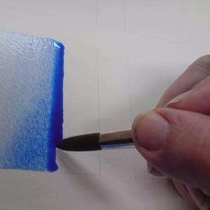 Leave the board tilted while the colour dries so that the colour does not run back upwards.