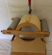 move the two original clamps to the other end of the rollers, so now you have 4 clamps fitted to the rollers, one at each end.