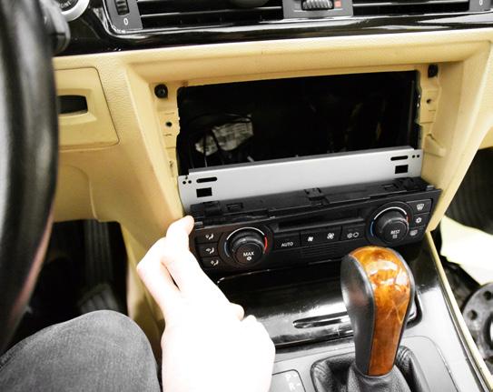 Install the provided trim piece onto the face of the climate control