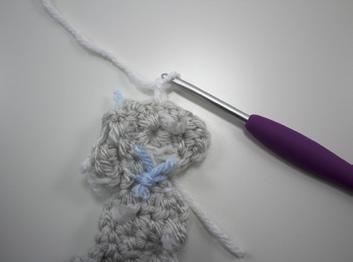 Clip close to leaving enough yarn on each side of knots to make the