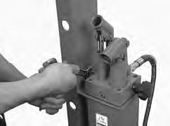 Securing hydraulic ram to mounting plate with ram collar. 6. Attach hydraulic reservoir assembly to right side of press column (see Figure 7) with (2) M10-1.