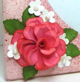 Using the shades of pink quilling strips, I added two simple hearts with a crimped border.