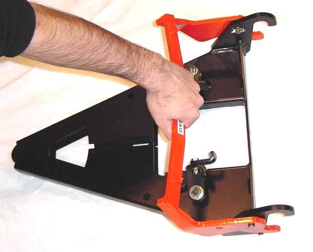 Apply slight downward pressure to the handle and rotate the main and secondary lockdown tabs into the closed position (away from center of A-Frame), shown in figure 11