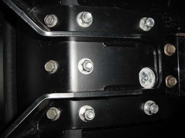 Then install the three bolts in the front set of holes.