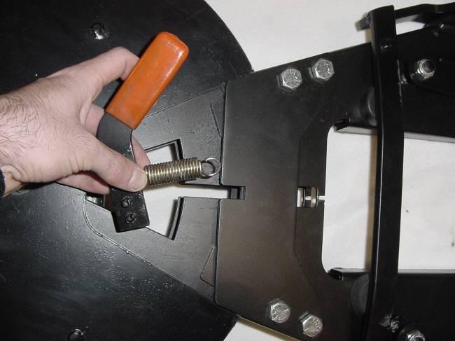 Tighten until nearly all slack is removed from the bolt while the A-frame is allowed to rotate freely in the trip frame pocket. 6.3 Install the blade angle handle.