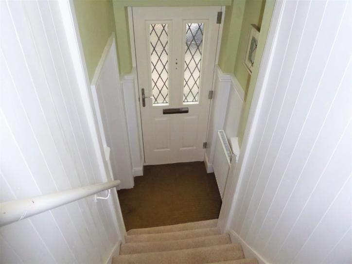 Deep moulded dado rail, skirting boards and door architraves.