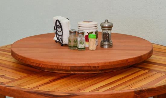 E. Lazy Susan A Lazy Susan is a revolving tray for foods, condiments, etc., placed usually at the center of a round table. You can choose between a 20" and a 25" diameter version. They are 3" tall.