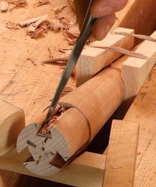 Now position one of the leg dovetails on the post s end grain so that it sits flat and the tips of the shoulders just touch the rim of the post. Put it just to one side of one of the third marks.